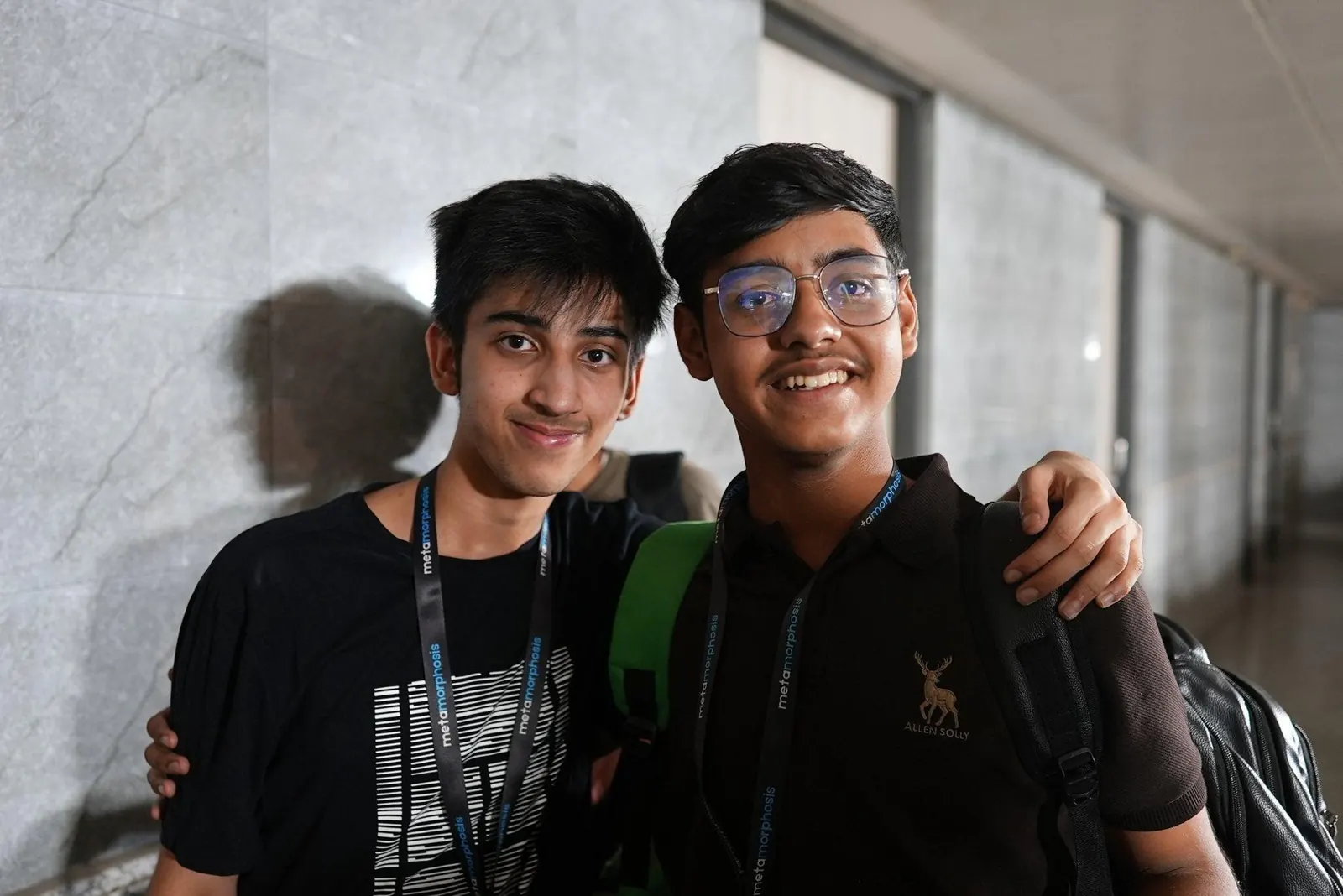 Two young builders standing together during a student innovation program