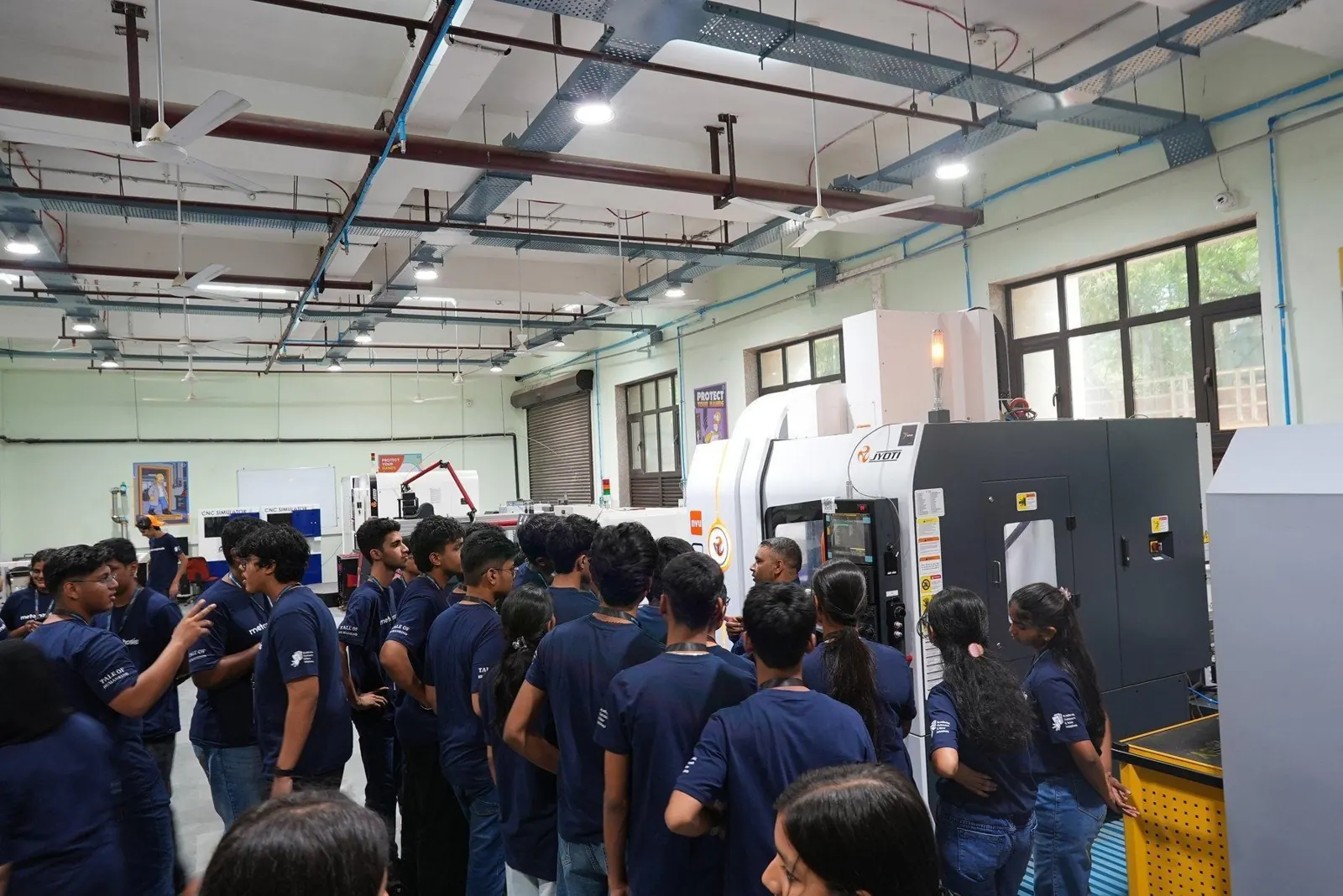 Students exploring equipment in a hands-on maker space