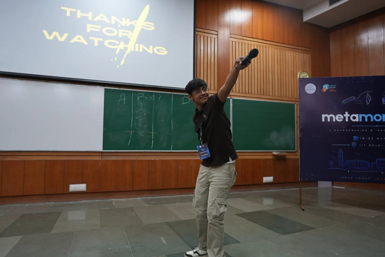 A young program participant presenting on stage during Metamorphosis